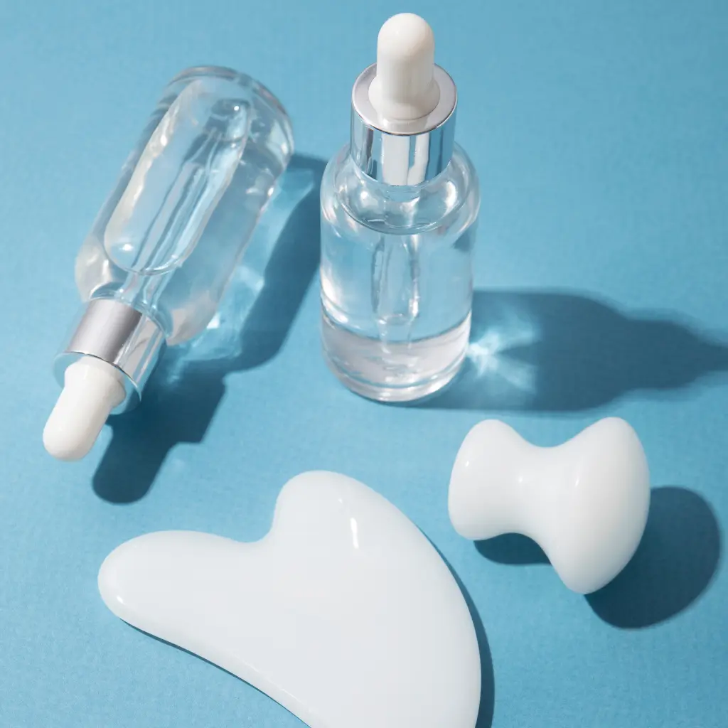Skincare tools and serum textures representing a skin barrier-focused routine