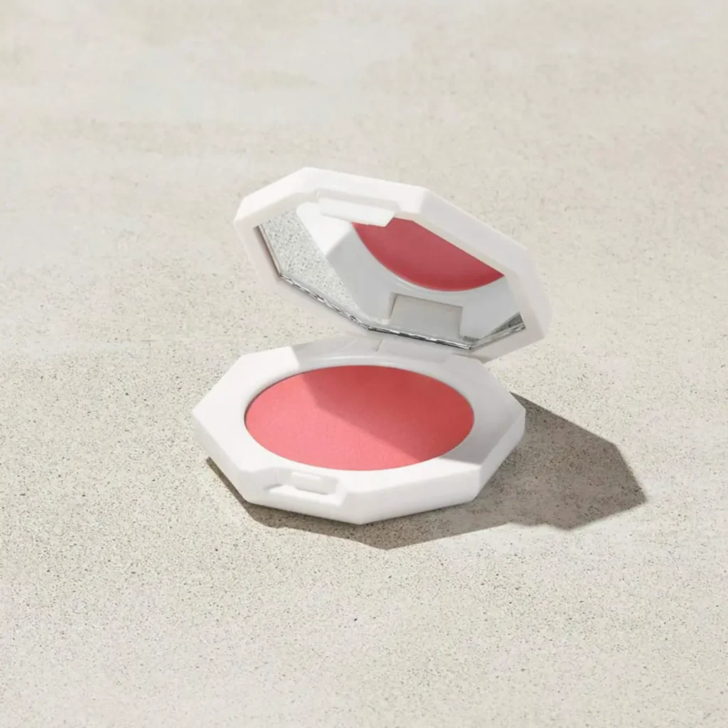 Fenty Beauty Cheeks Out Cream Blush in Petal Poppin, a soft pink cream blush with a natural skin-like glow