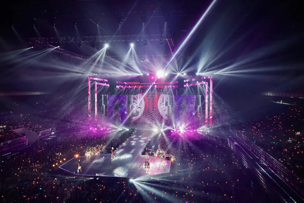 K-pop concert stage lighting showing how strong lights and distance affect how makeup appears on stage