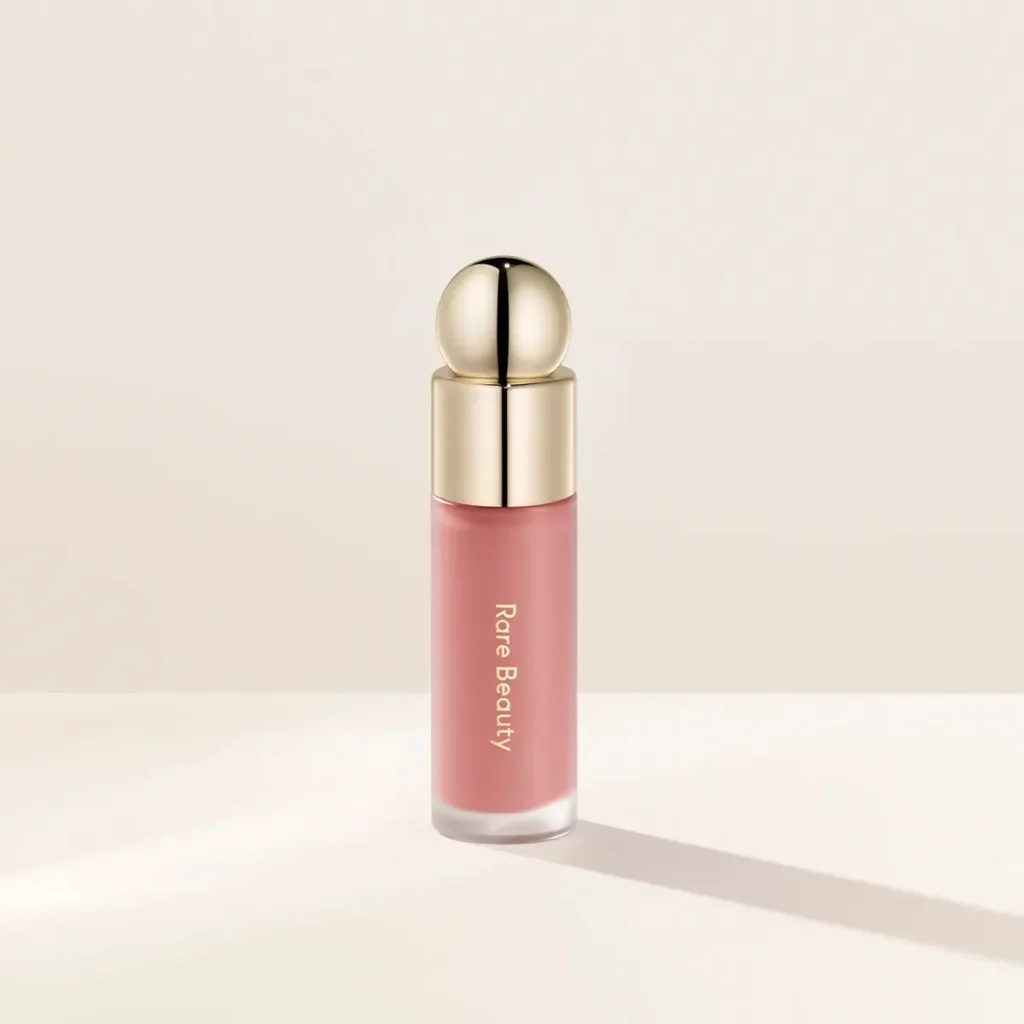 Rare Beauty Soft Pinch Liquid Blush in a soft muted pink shade that looks natural in indoor lighting